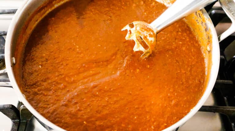 blending curry sauce with immersion blender