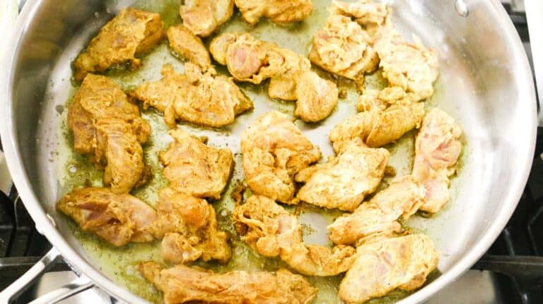 cooking chicken on stainless steel pan