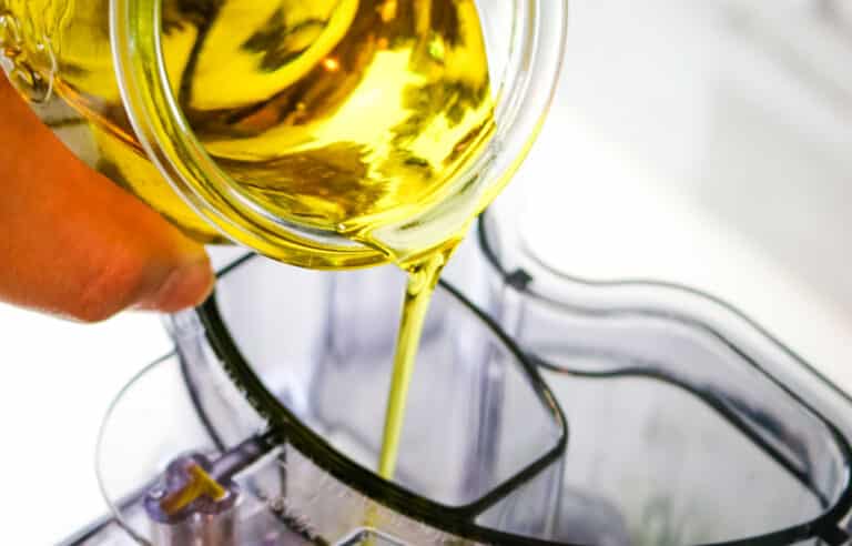 olive oil poured into food processor