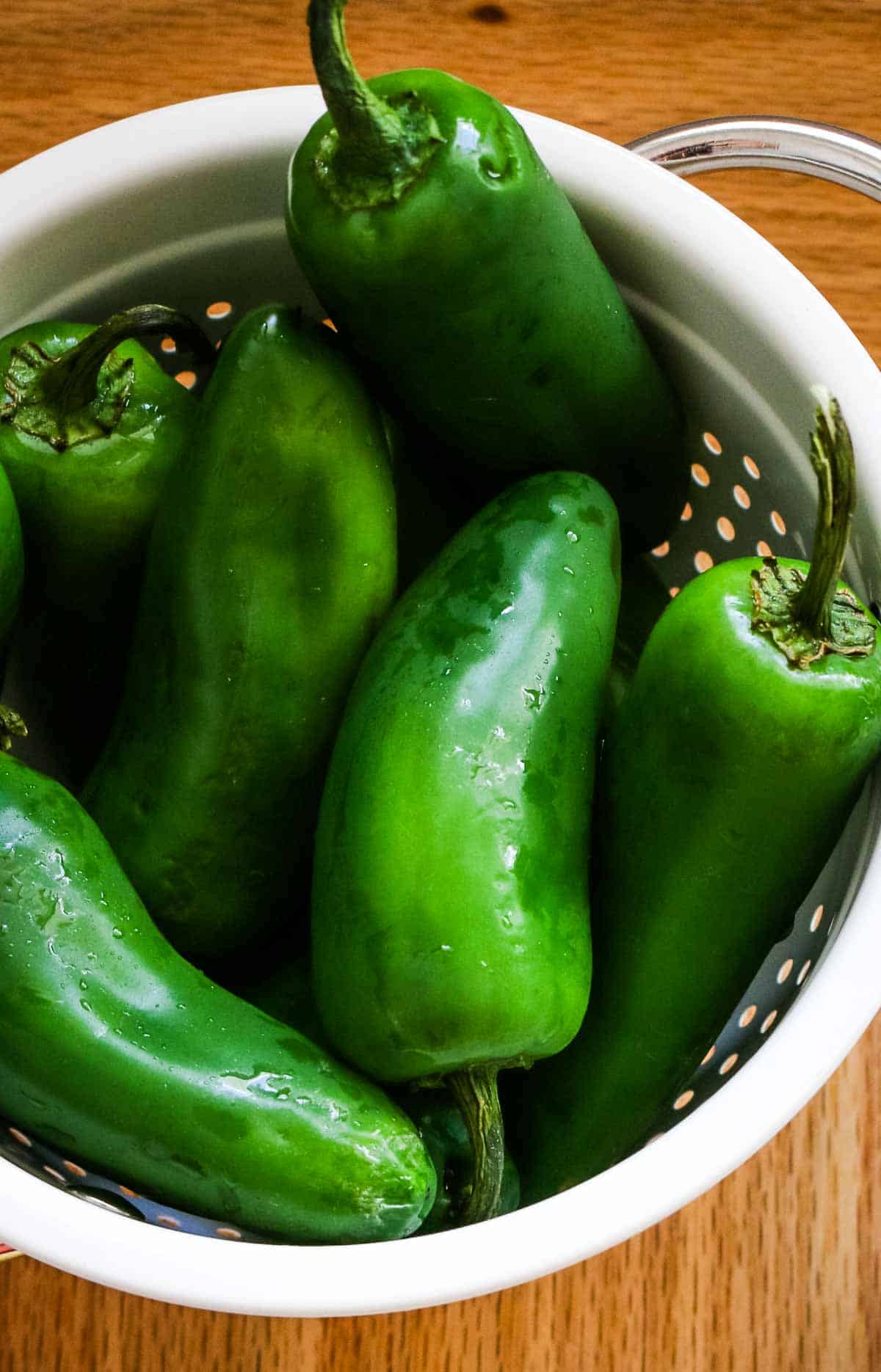 fresh jalapeno peppers in a colander