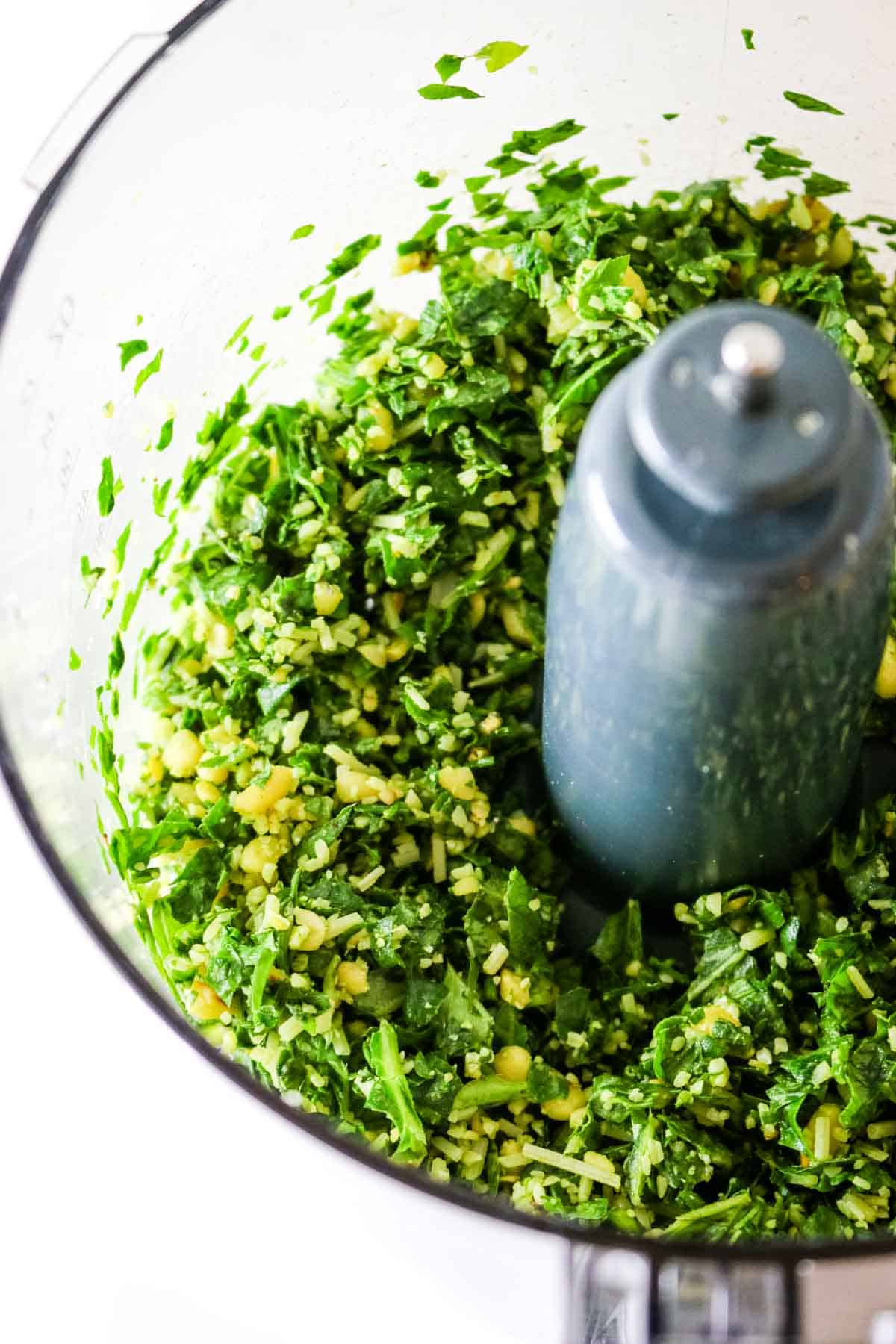 mincing basil and nuts in food processor
