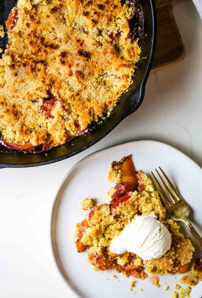 peach cobbler with ice cream on plate