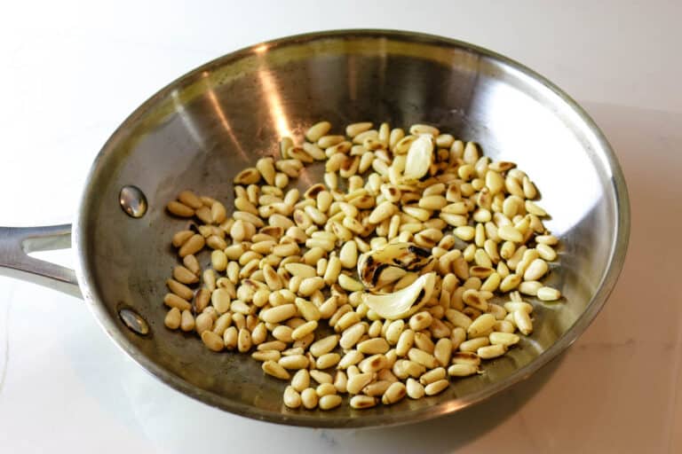 roasting pine nuts in a small pan