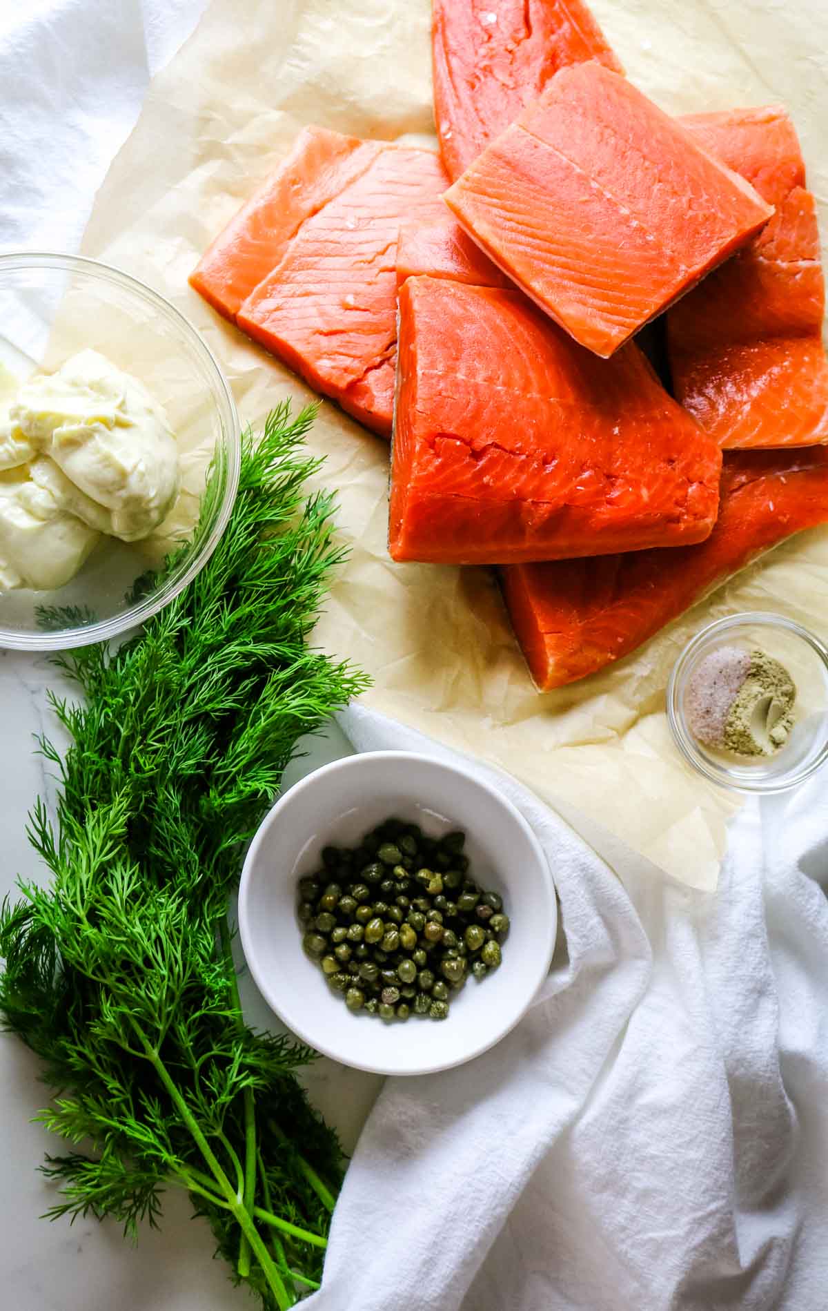 raw salmon, capers, fresh dill, and mayonnaise.