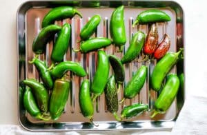 jalapeno peppers on a baking sheet.