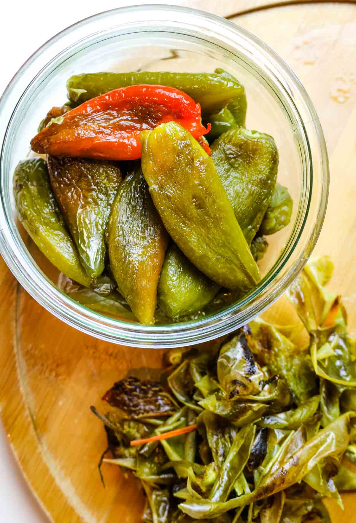 peeled jalapeno peppers in a weck jar with all the membrane to the side.