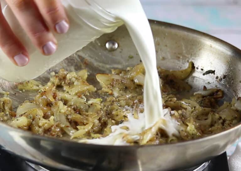 Adding cream to caramelized onions.