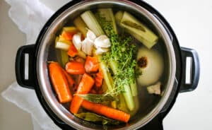 instant pot with vegetable scraps and water.