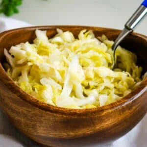 raw sauerkraut in wooden bowl.