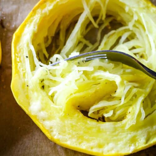 spaghetti squash in a ring with fork.