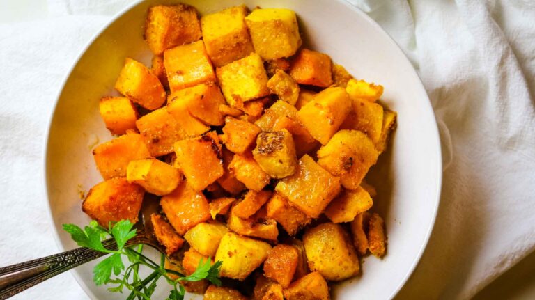 roasted butternut squash in a white bowl.