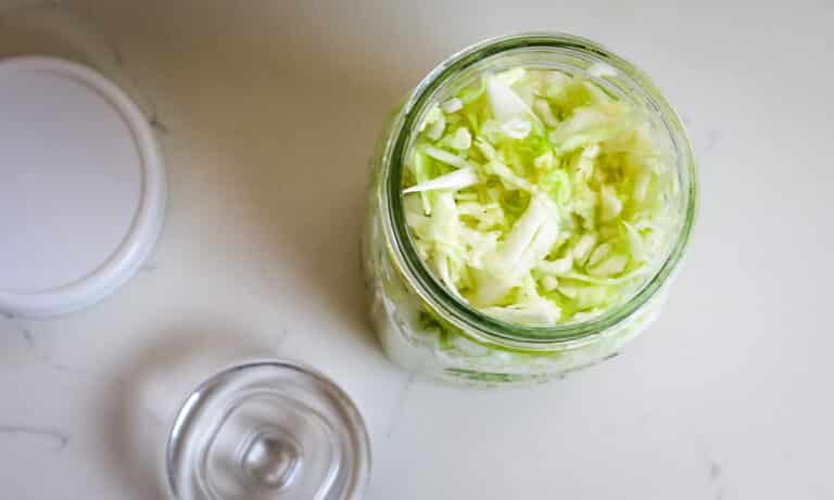 cabbage with salt in quart size jar.
