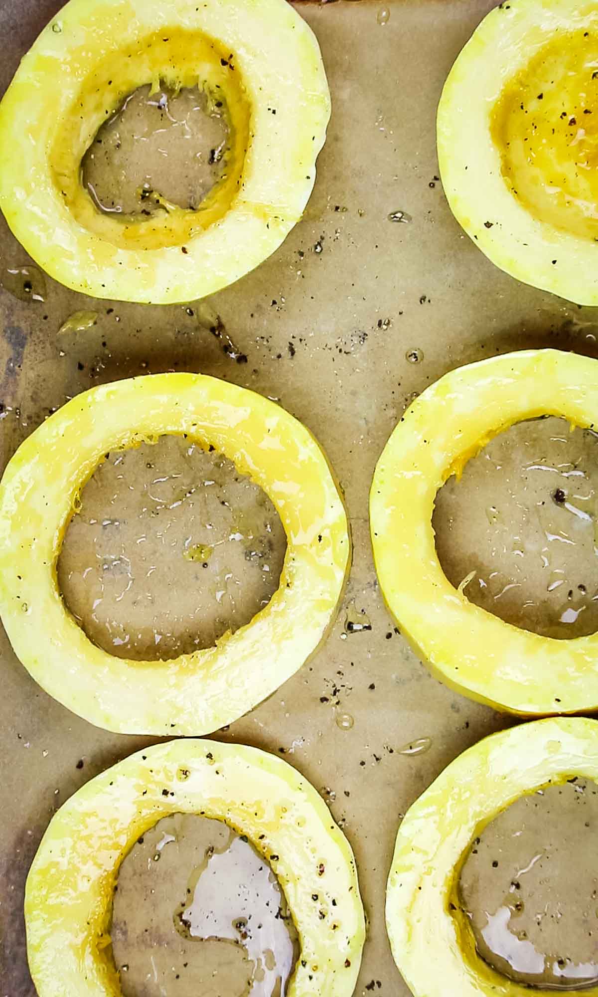 spaghetti squash rings seasoned with oil and salt and pepper.