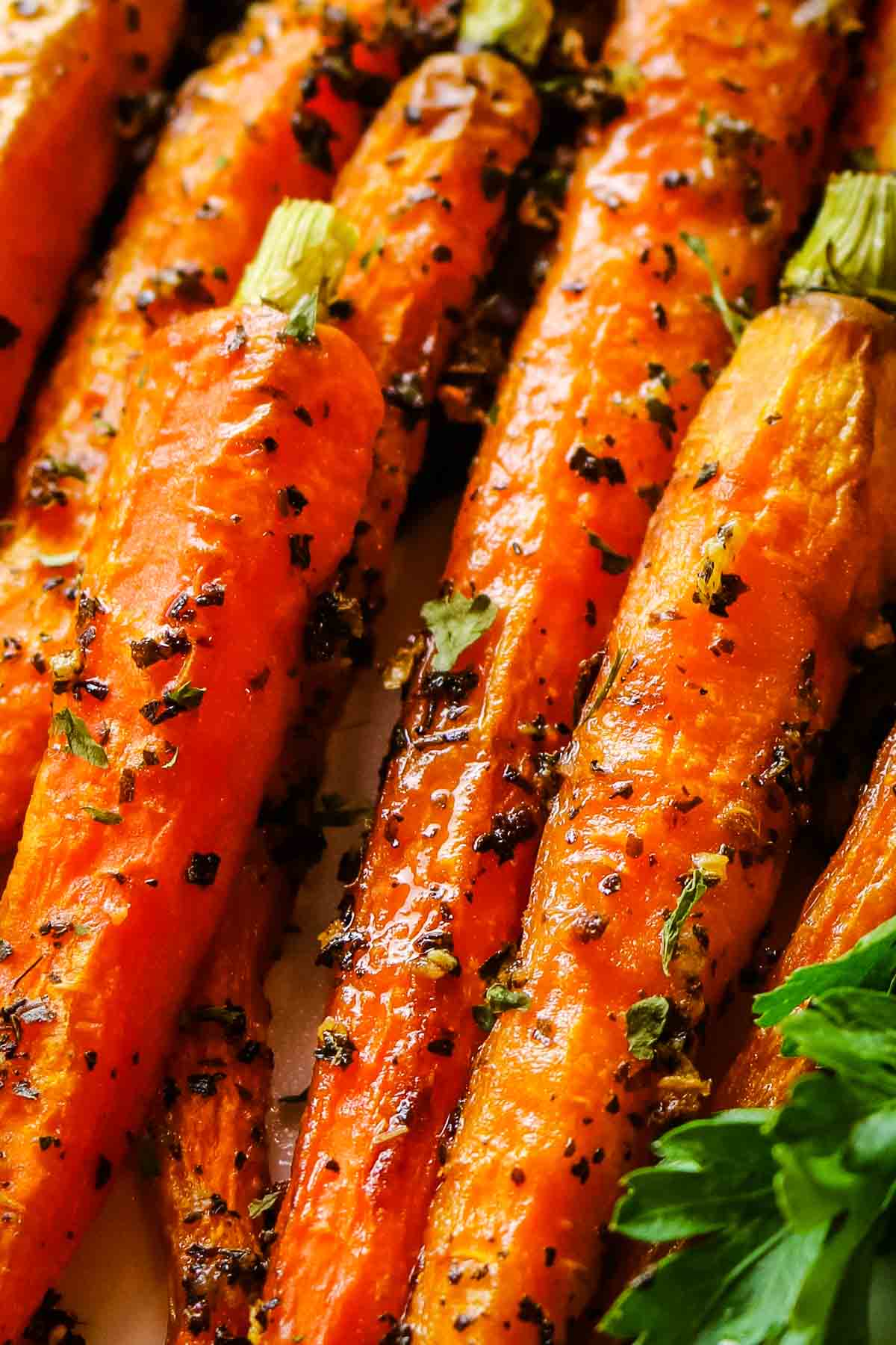 upclose roasted carrots with herbs.