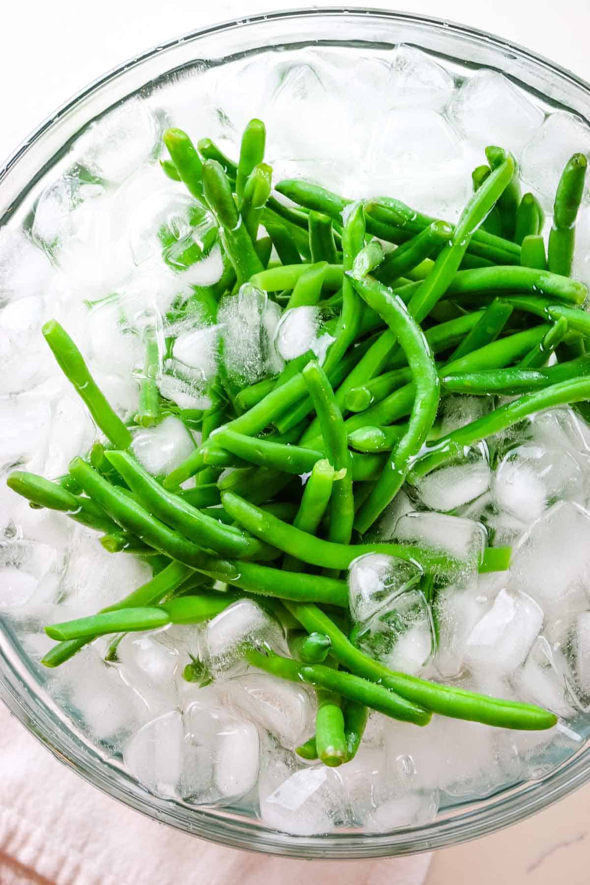 blanching green beans in ice water.