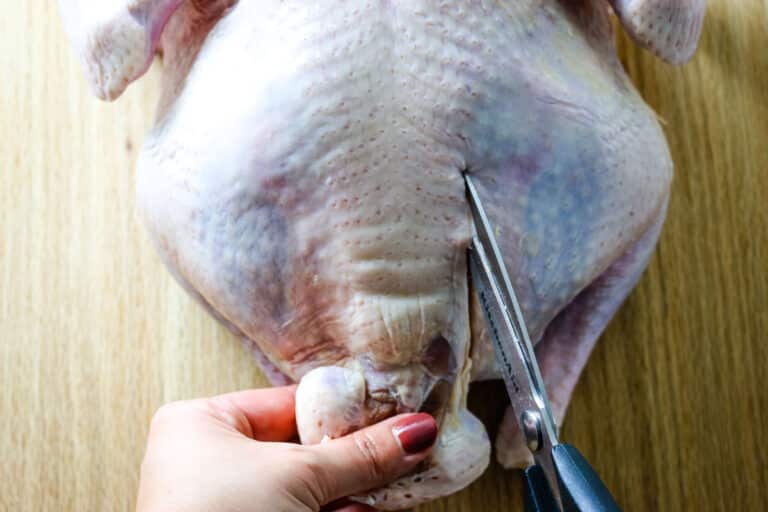 cutting out the spine of turkey.