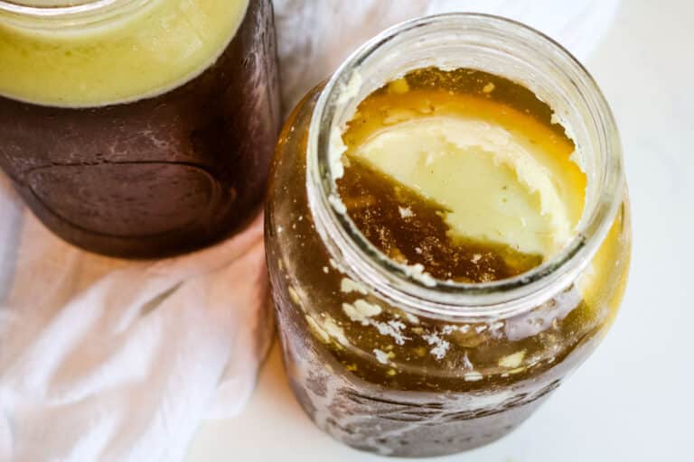 beef fat and beef bone broth in jars.