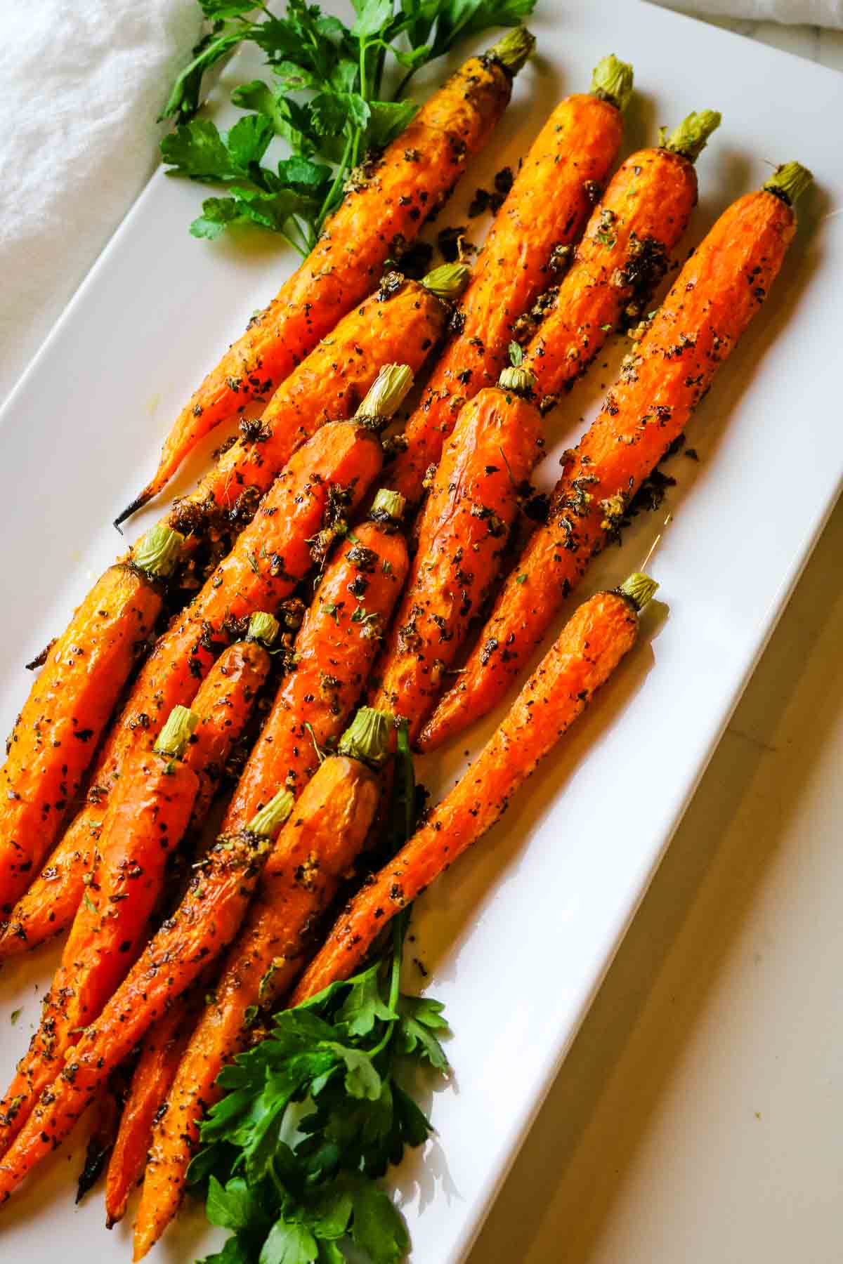 carrots roasted on white platter.