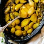 garlic in olive oil in baking dish.