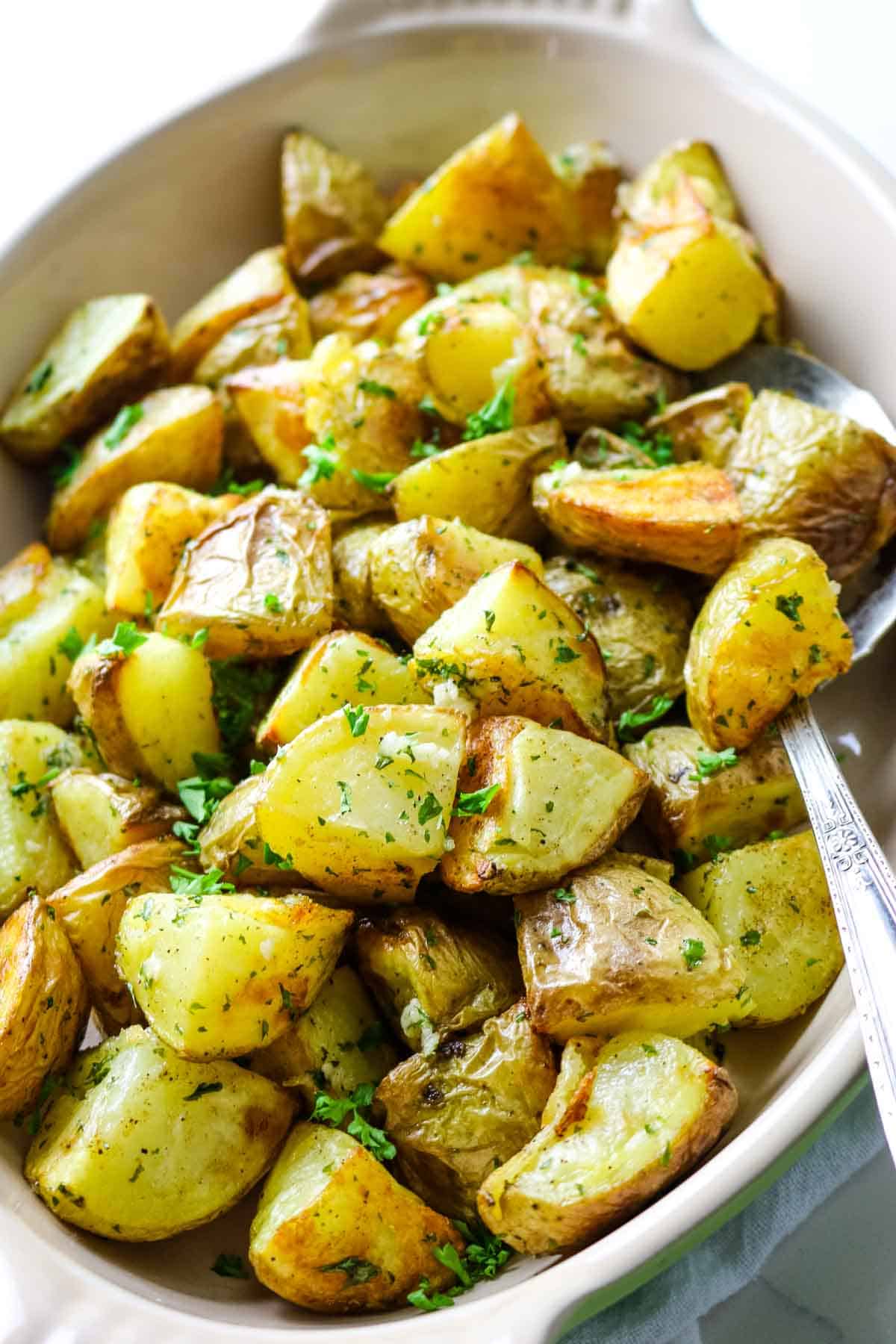 crispy yellow potatoes in serving platter