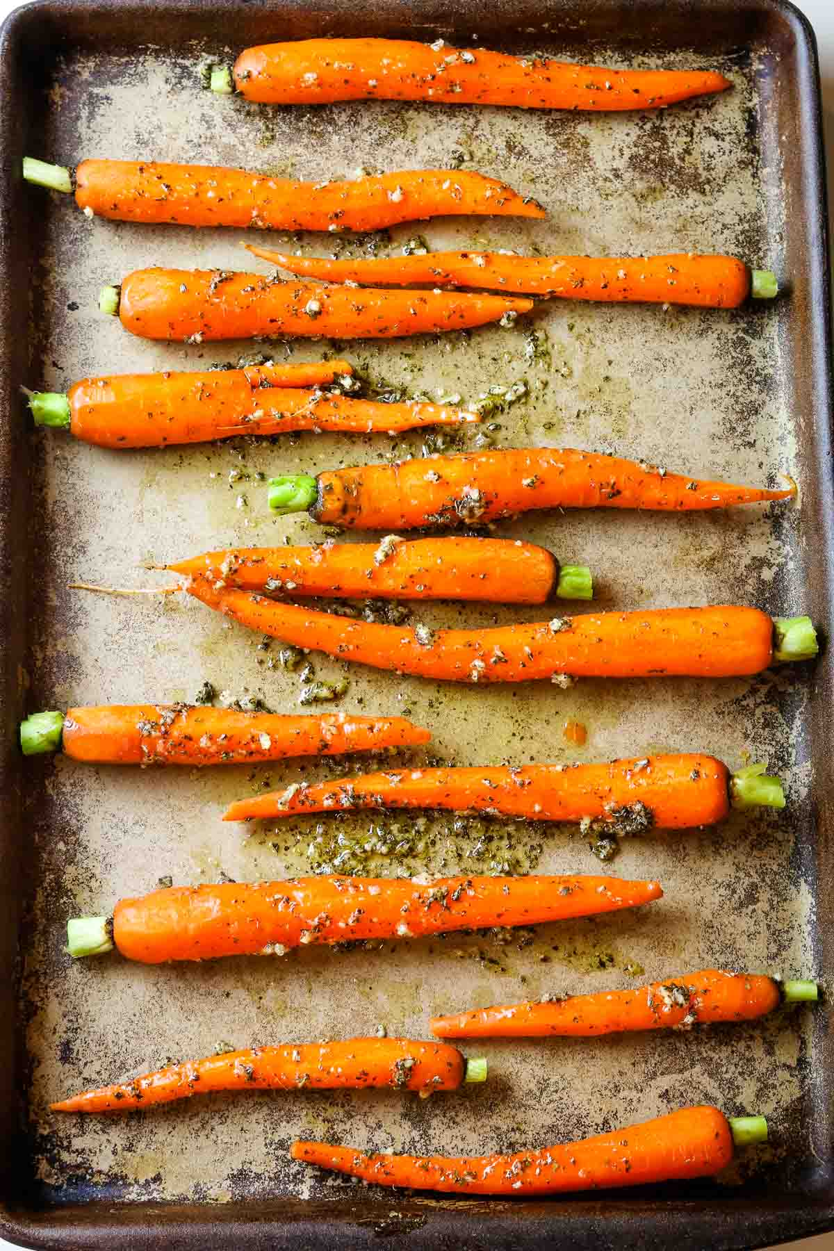 carrots spread out on sheet.