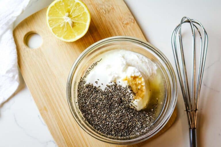 Greek yogurt in small dish with chia seeds for fall fruit salad.