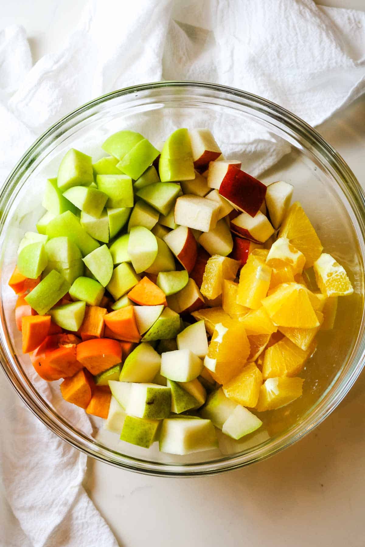diced fruit in glass bowl.
