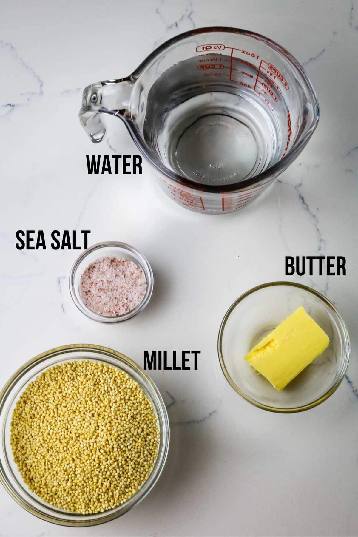 ingredients uncooked millet with water and butter.