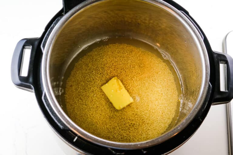 millet, water and butter in instant pot.