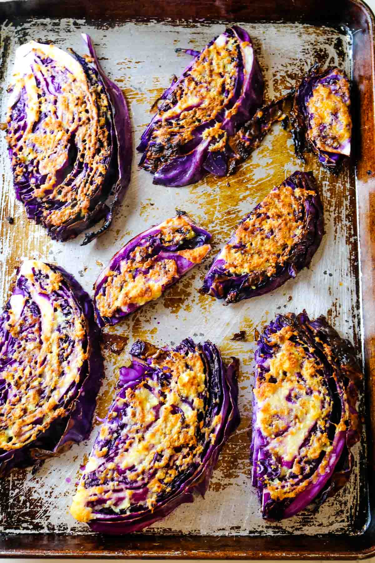 roasted red cabbage with golden cheese on top.