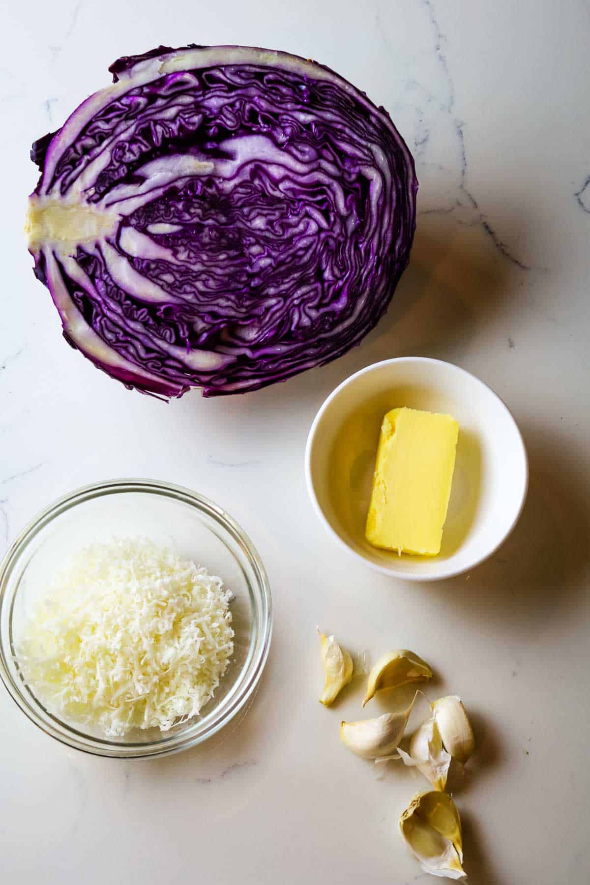 Red cabbage, butter, parmesan and garlic for red cabbage steaks.
