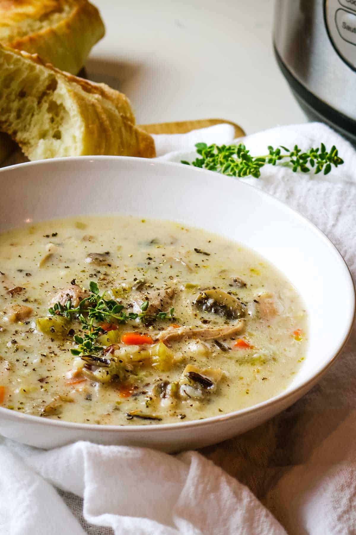 chicken wild rice soup with fresh herbs and crusty bread.