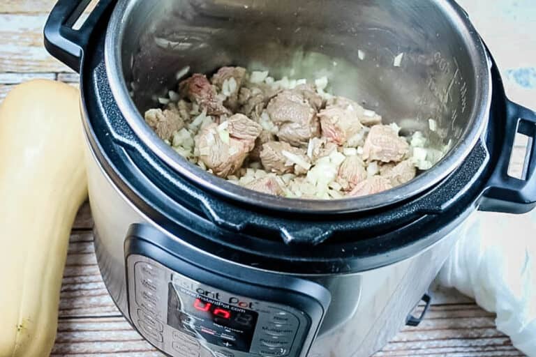 adding onions to lamb in instant pot.