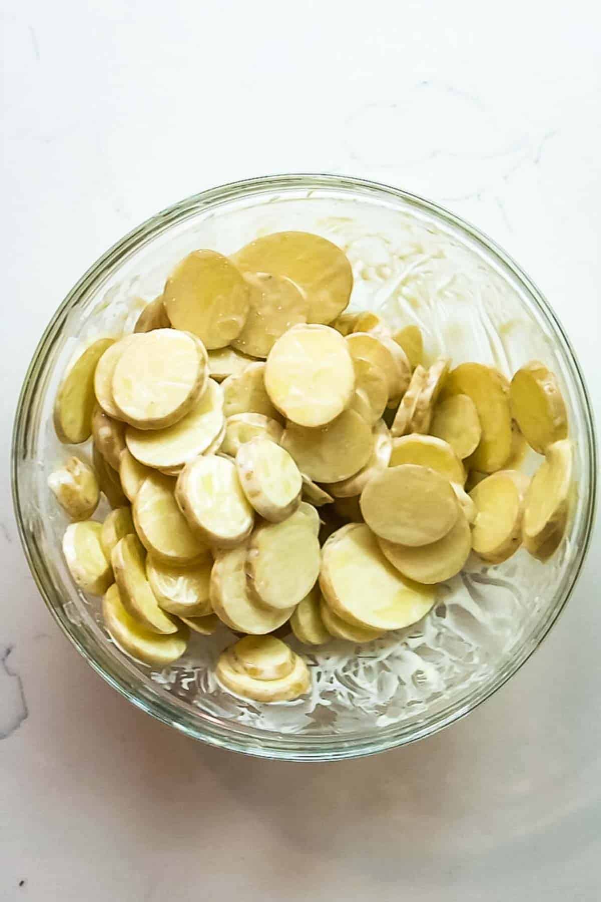 sliced potatoes in a large bowl