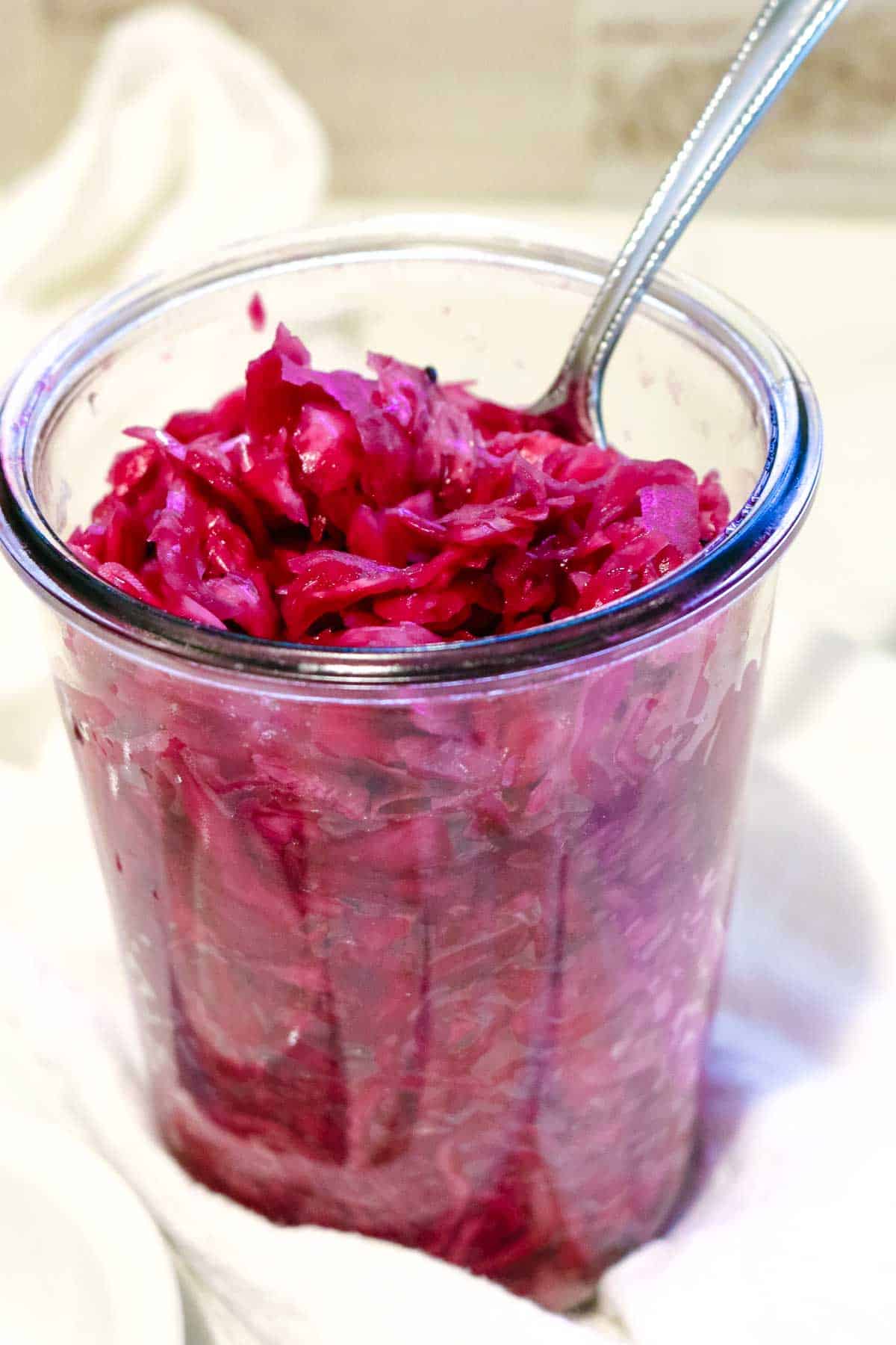 https://prepareandnourish.com/wp-content/uploads/2023/04/red-cabbage-sauerkraut-in-weck-jar.jpg