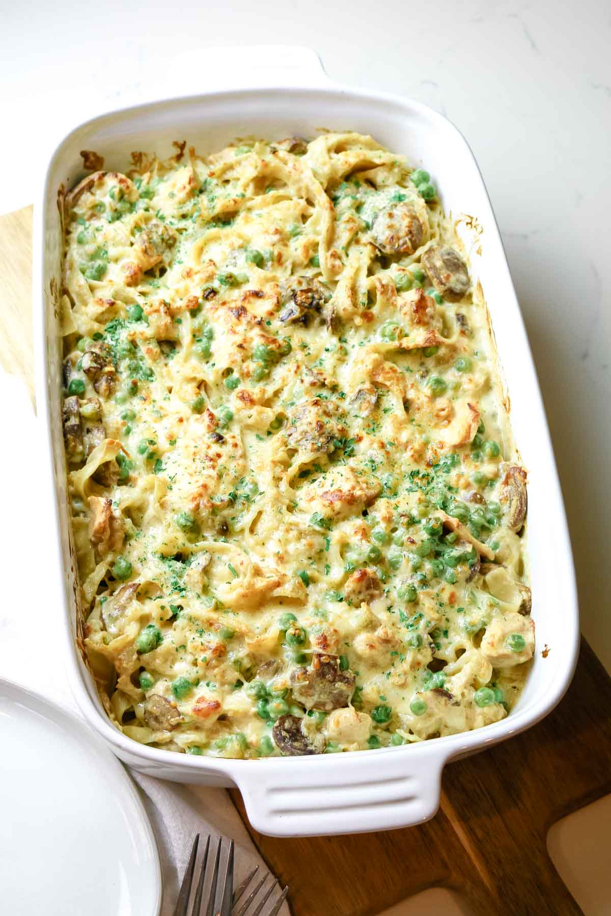 tuna noodle casserole in white baking dish.