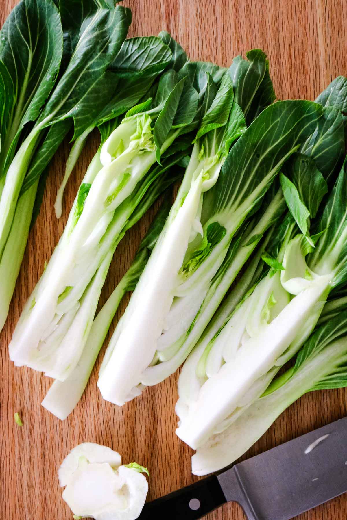 trimmed ends of bok choy with knife to the side.