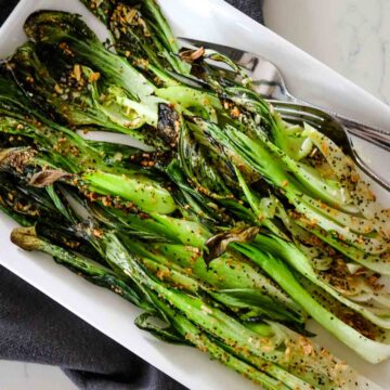 roasted bok choy on a white platter