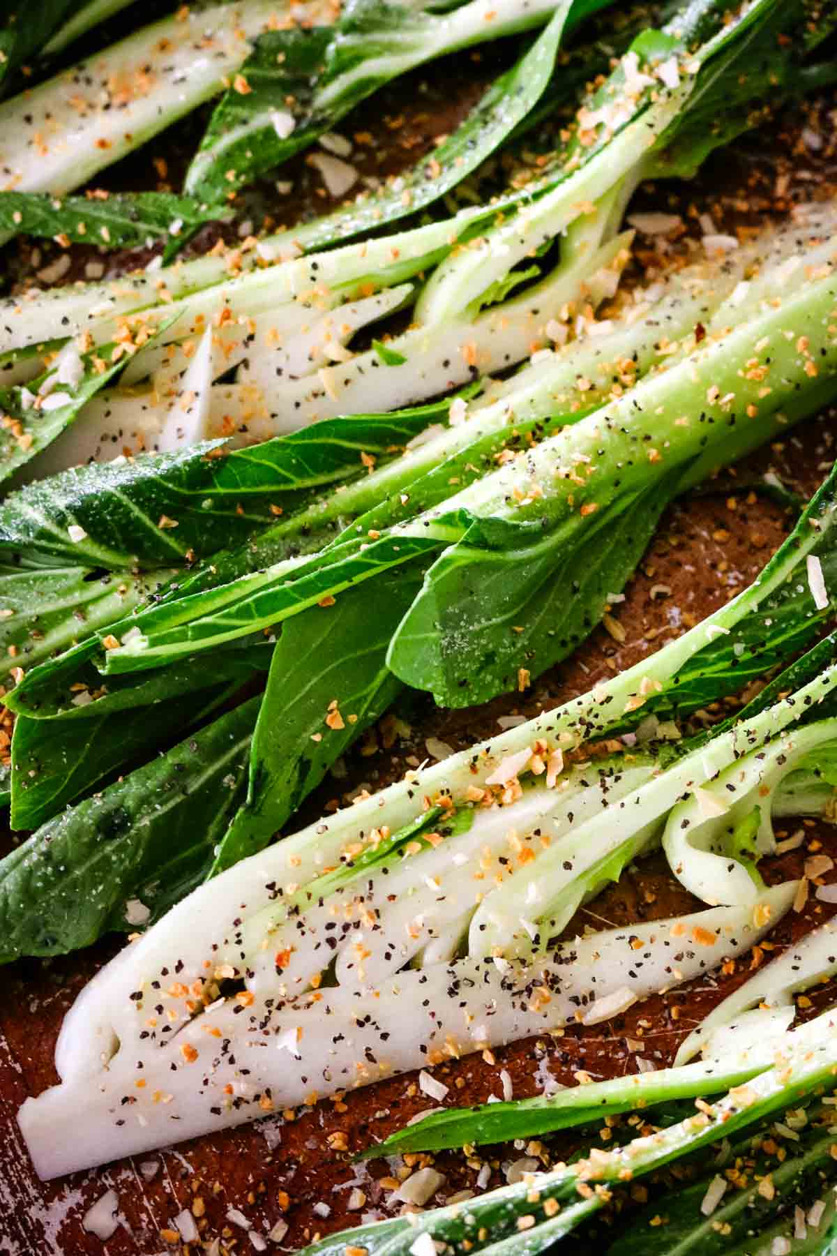 seasoned bok choy on baking sheet for roasted bok choy