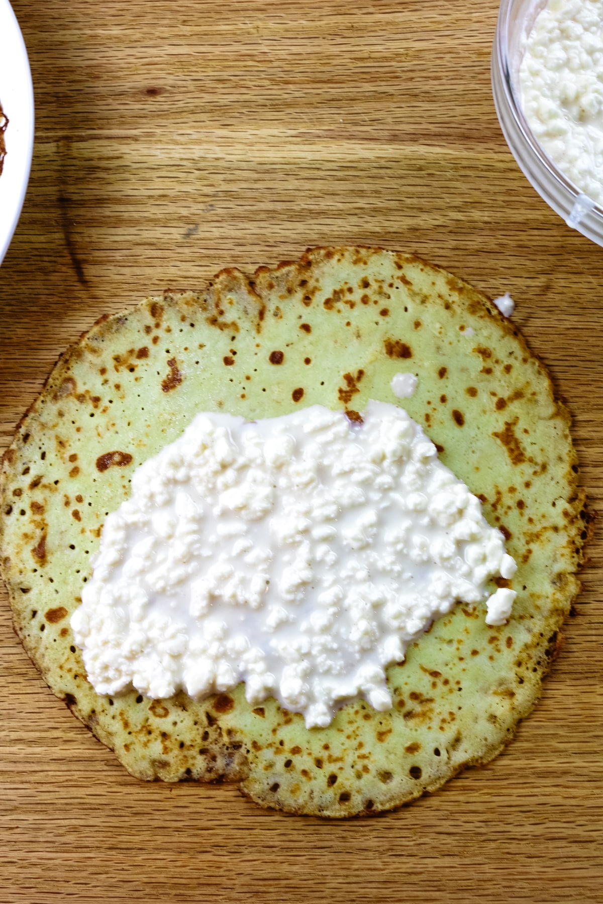 cottage cheese mixture spread on crepe.