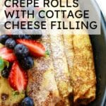 crepe rolls in a baking dish with text overlay that says "crepe rolls with cottage cheese filling"