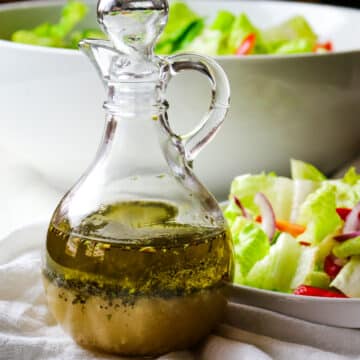 salad dressing in a clear bottle with salad dressing on the right side.