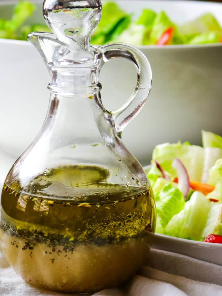 salad dressing in a clear bottle with salad dressing on the right side.
