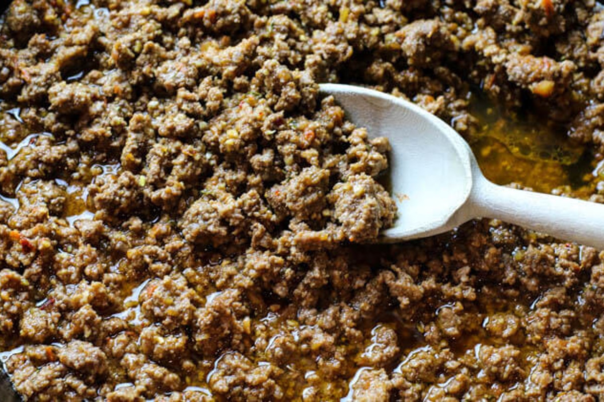 taco seasoning upclose with a wooden spoon.