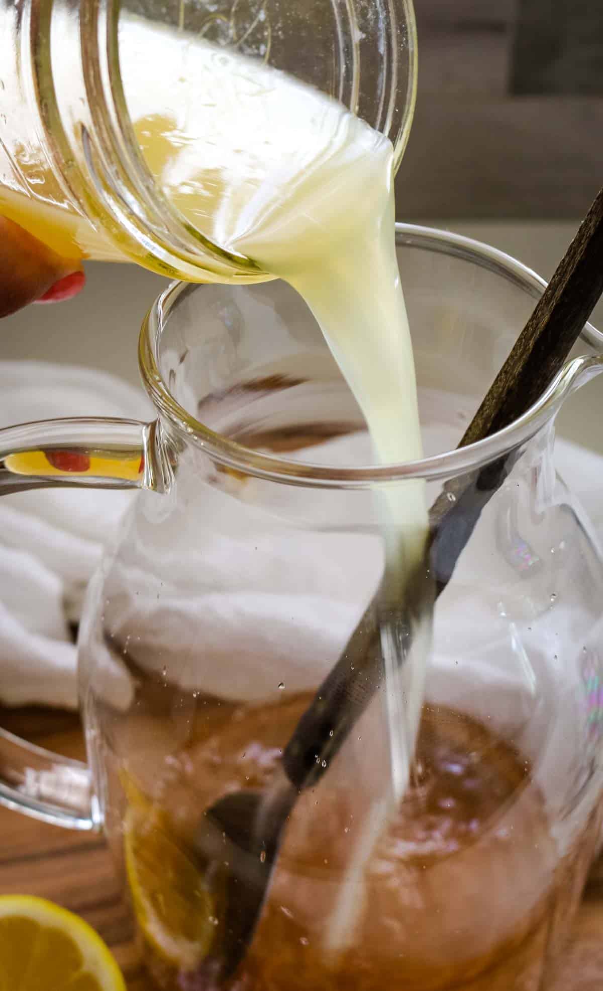 freshly squeezed lemon juice poured into a glass clear pitcher.
