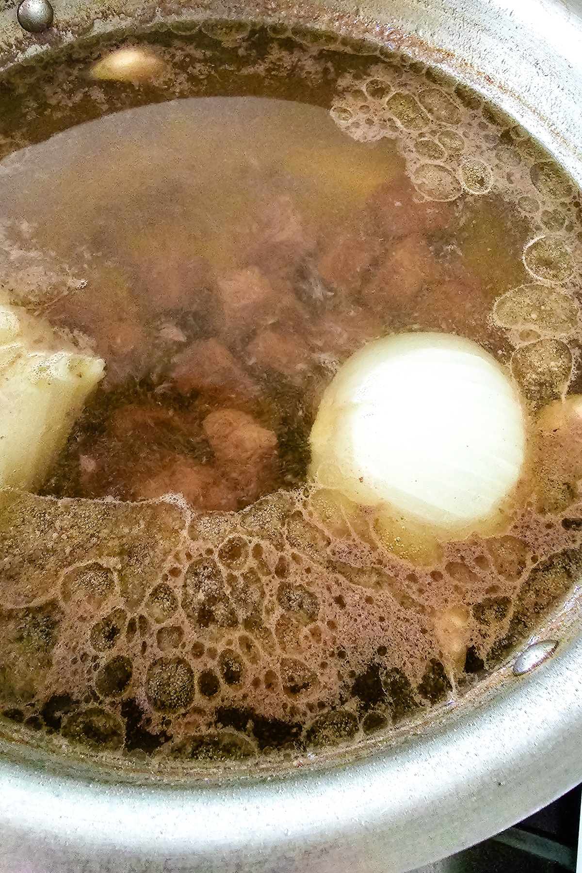 water brining to a boil in a pot.