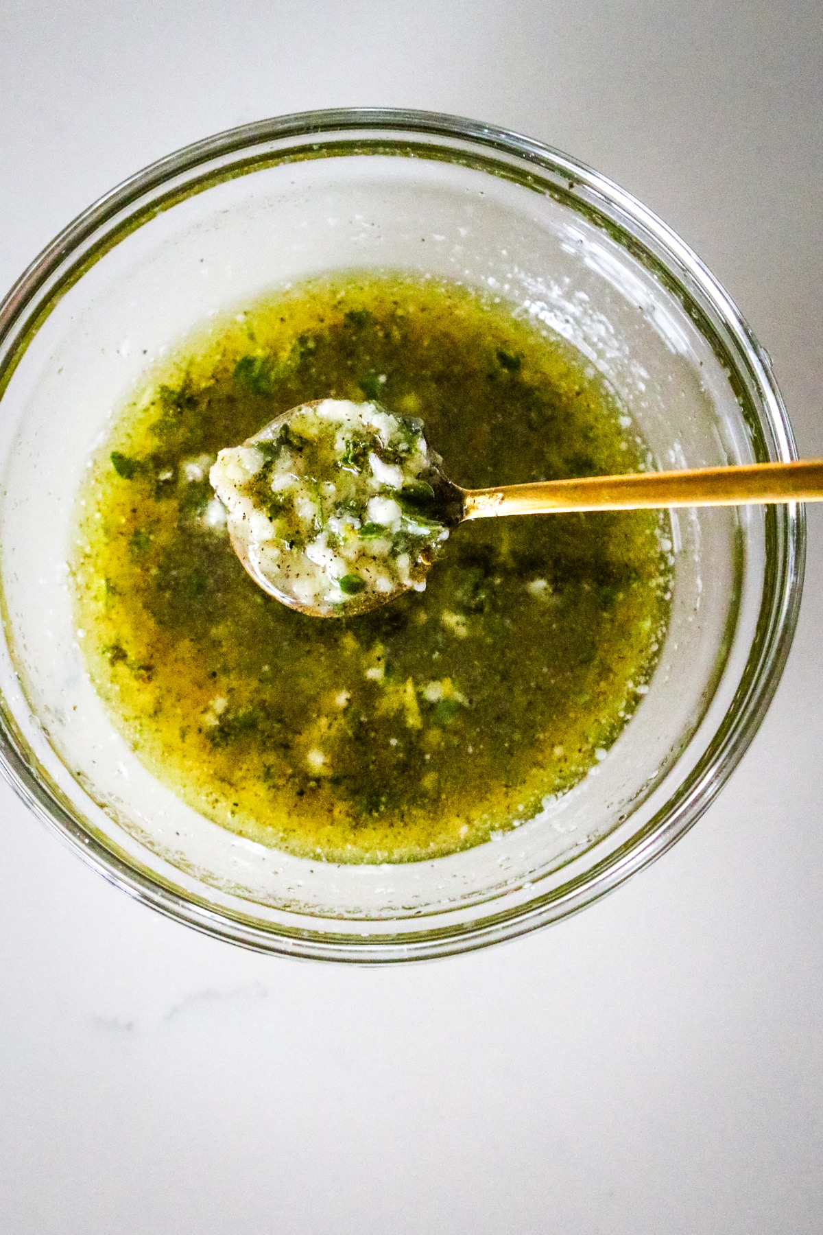 marinade with herbs, olive oil, and minced garlic.