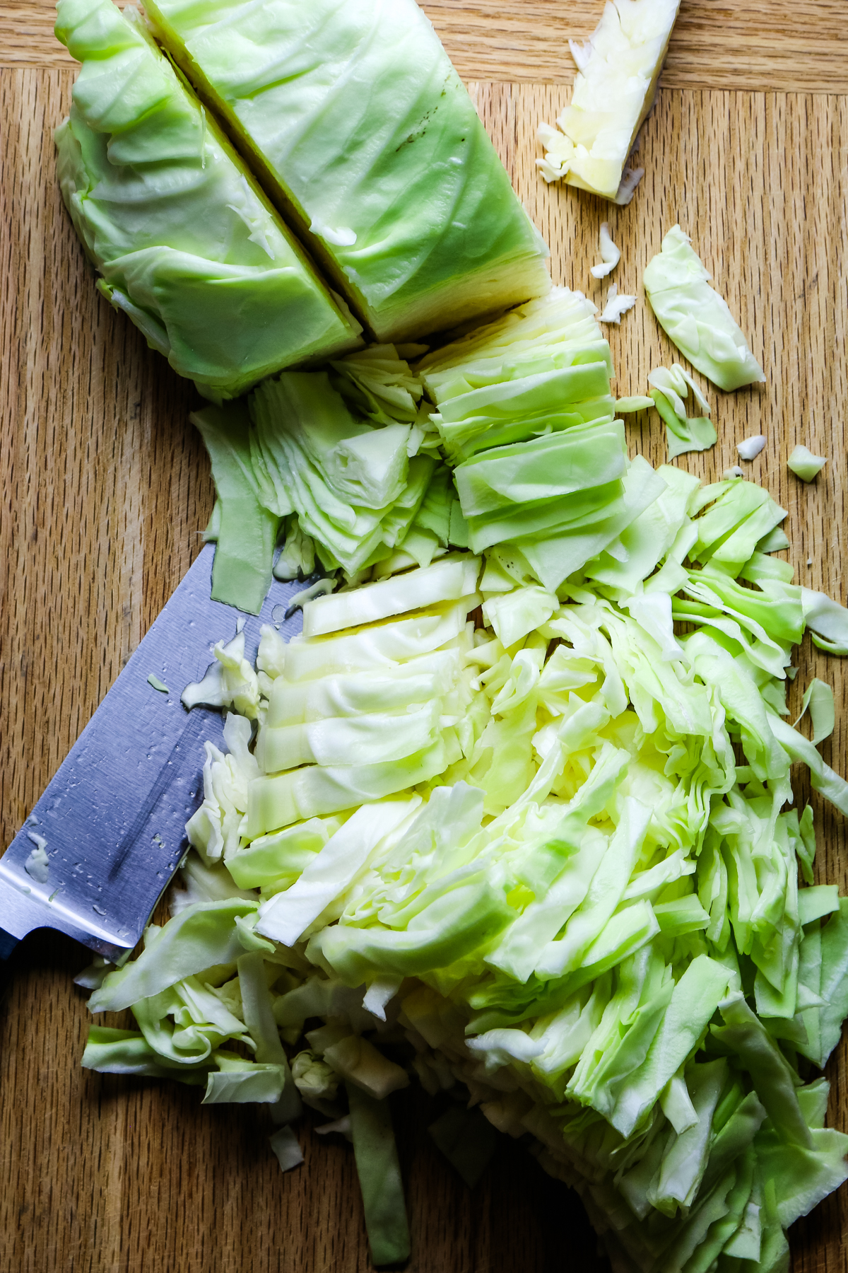 cutting cabbage into small strips.