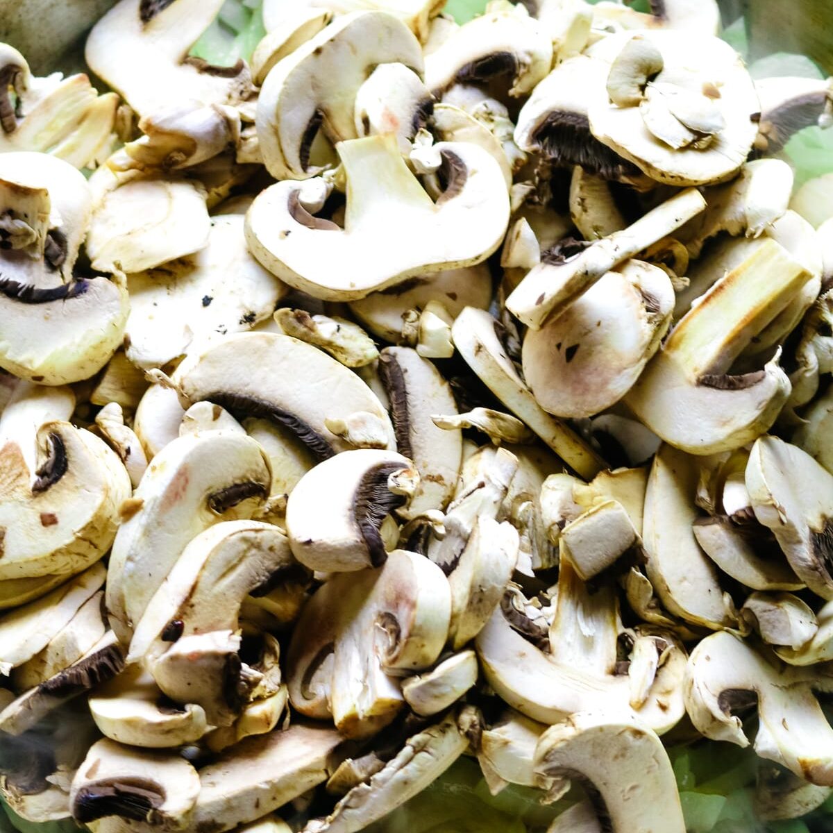 sliced mushrooms added to skillet.