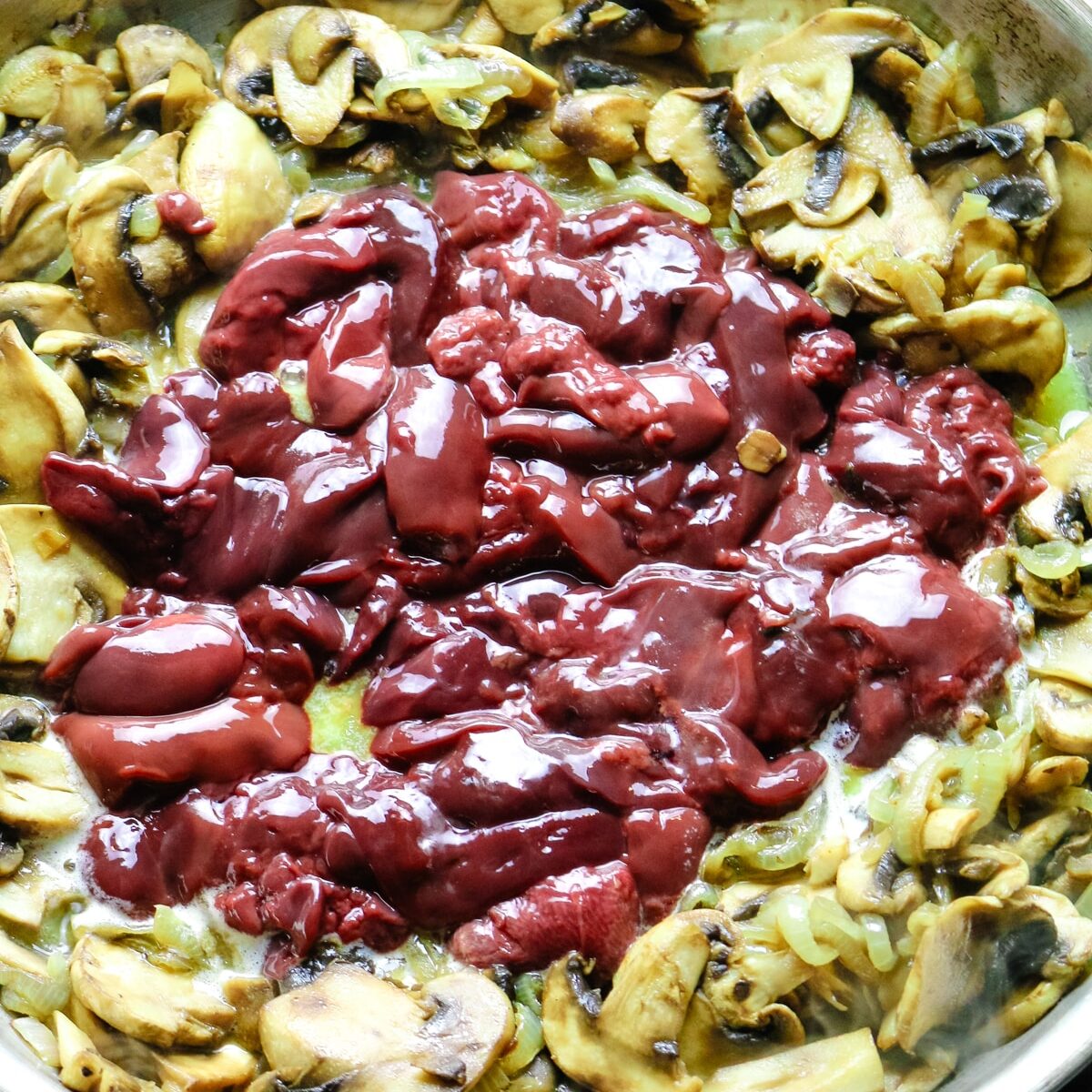 livers added to skillet with cooked mushrooms and onions.